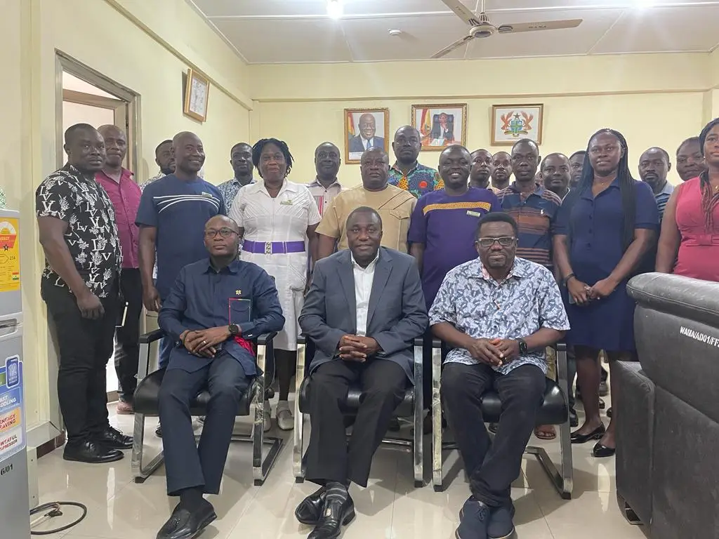 Mission team members in an office